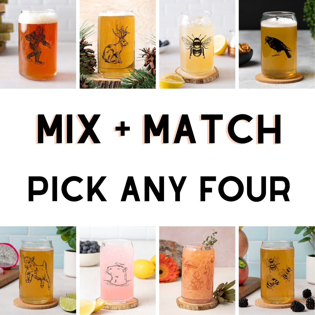 Variety of Mix and Match can-shaped beer glasses showcasing original designs like a Sasquatch, antlers, and a bee, with a vibrant selection of drinks inside.