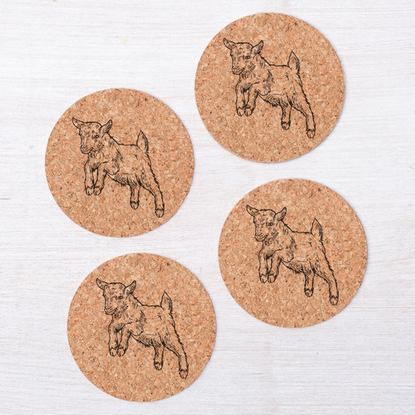 Set of four baby goat cork coasters by Counter Couture showcasing a playful jumping baby goat design on a natural cork surface.