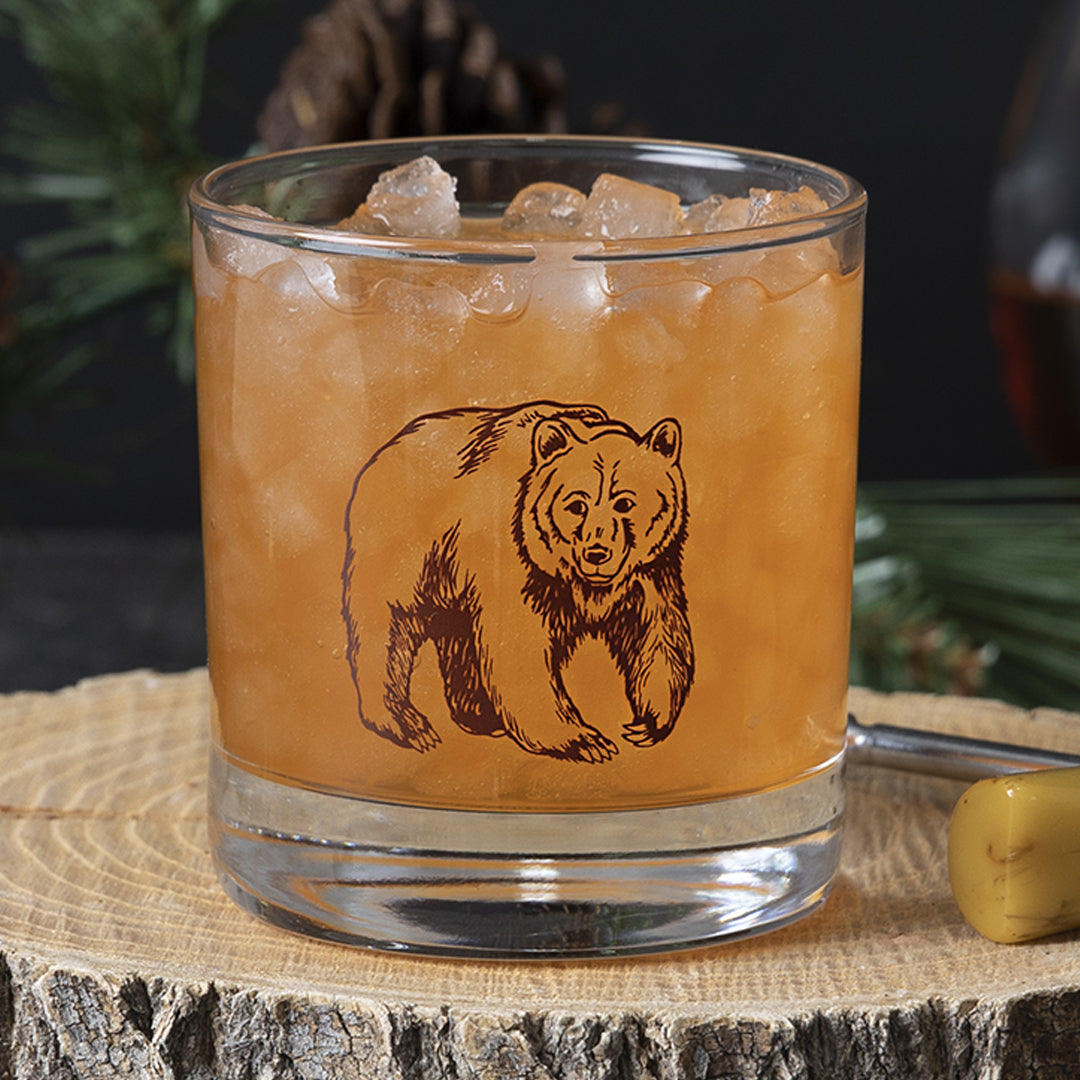 Rocks glass printed with a brown hand-drawn grizzly bear.