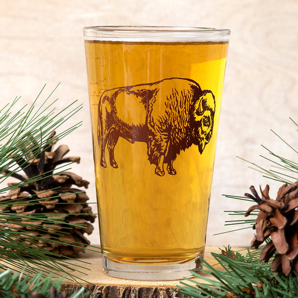 Bison Pint Glass showcasing a unique hand-drawn illustration, perfect for enjoying your favorite brew.