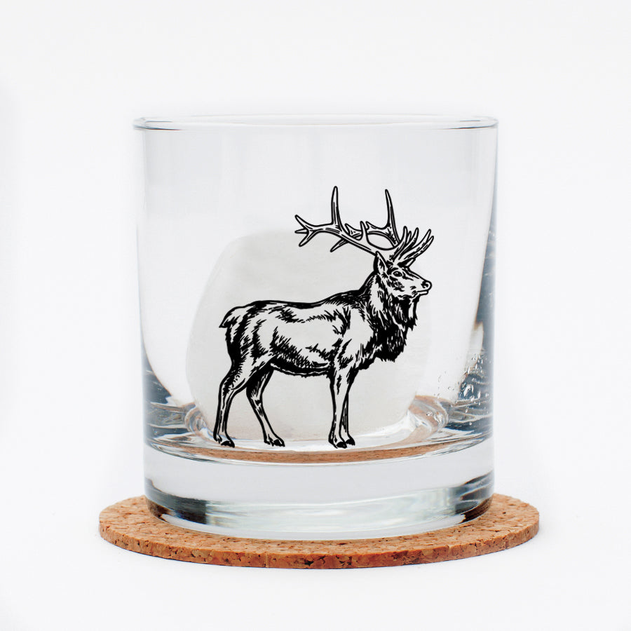 Detailed close-up of the Elk Rocks Glass, highlighting its permanent print and lead-free glass material.