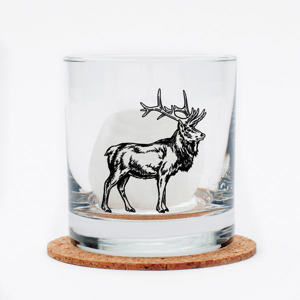 Detailed close-up of the Elk Rocks Glass, highlighting its permanent print and lead-free glass material.