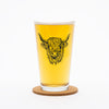 Counter Couture Highland Cow Pint Glass - 16 OZ showcasing a charming hand-drawn cow design, perfect for beer lovers and dishwasher safe pint glass.