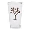 The stylish Joshua Tree Pint Glass, perfect for craft beer enthusiasts, sitting on a wooden table.