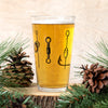 Lures Pint Glass featuring a unique hand-drawn fishing lure design, perfect for beer lovers and collectors.
