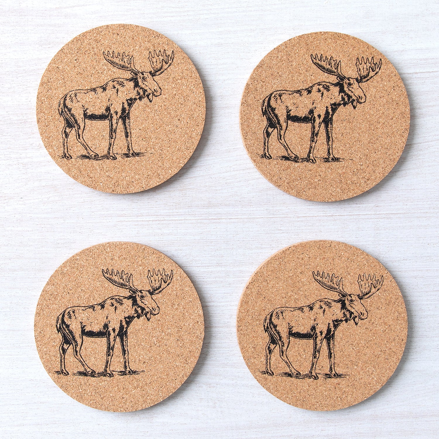 Moose Cork Coasters designed by Counter Couture, featuring a hand-drawn illustration, perfect for protecting your tabletop from hot or cold beverages.