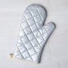 Stylish Highland Cow Oven Mitt from Counter Couture with silver quilted heat-resistant backing.