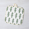 Saguaro Pot Holder showcased in a vibrant kitchen setting, highlighting its unique heat-resistant design and beautiful cactus motif.
