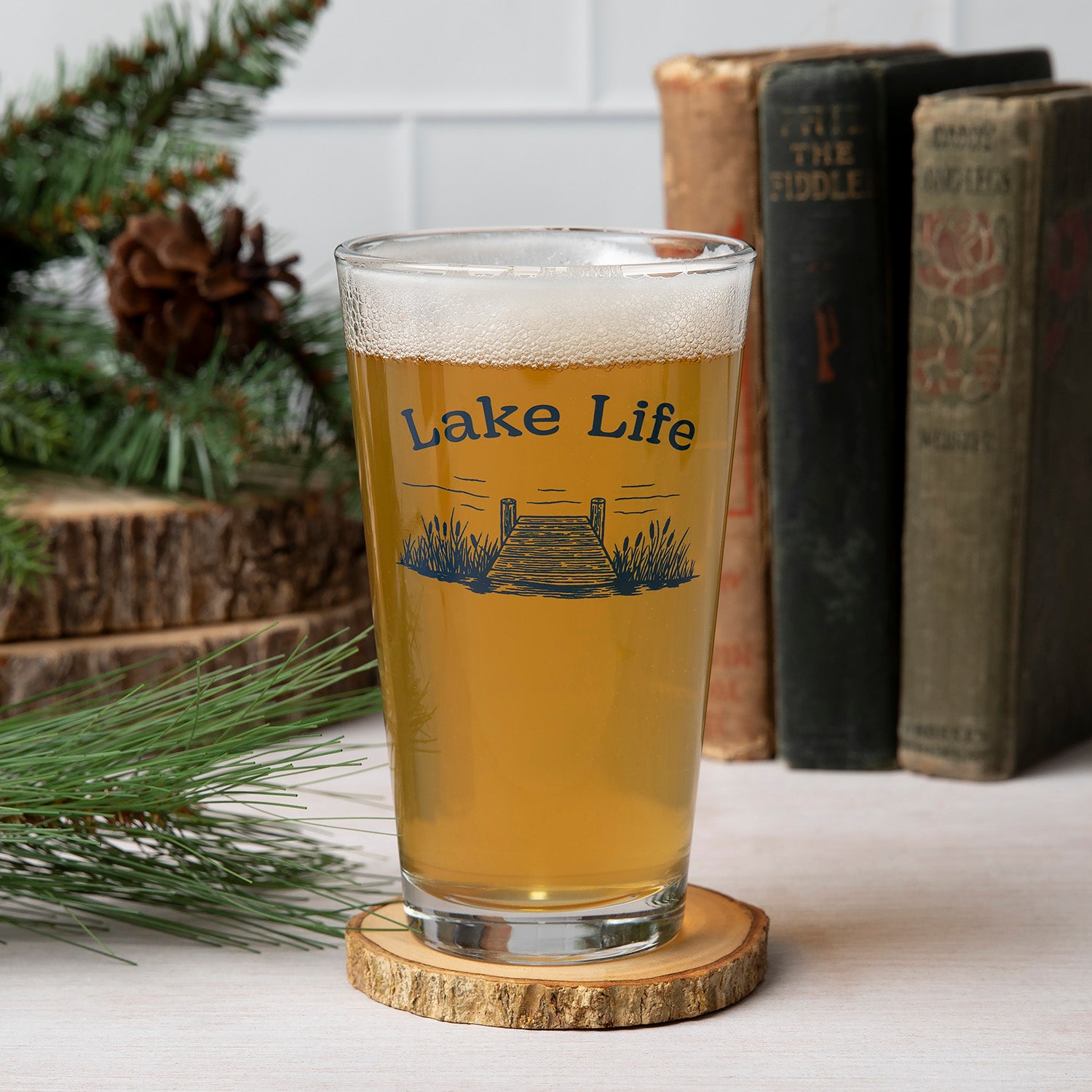 Stylish Lake Life Pint Glass featuring a hand-drawn illustration, perfect for beer lovers and crafted for durability.