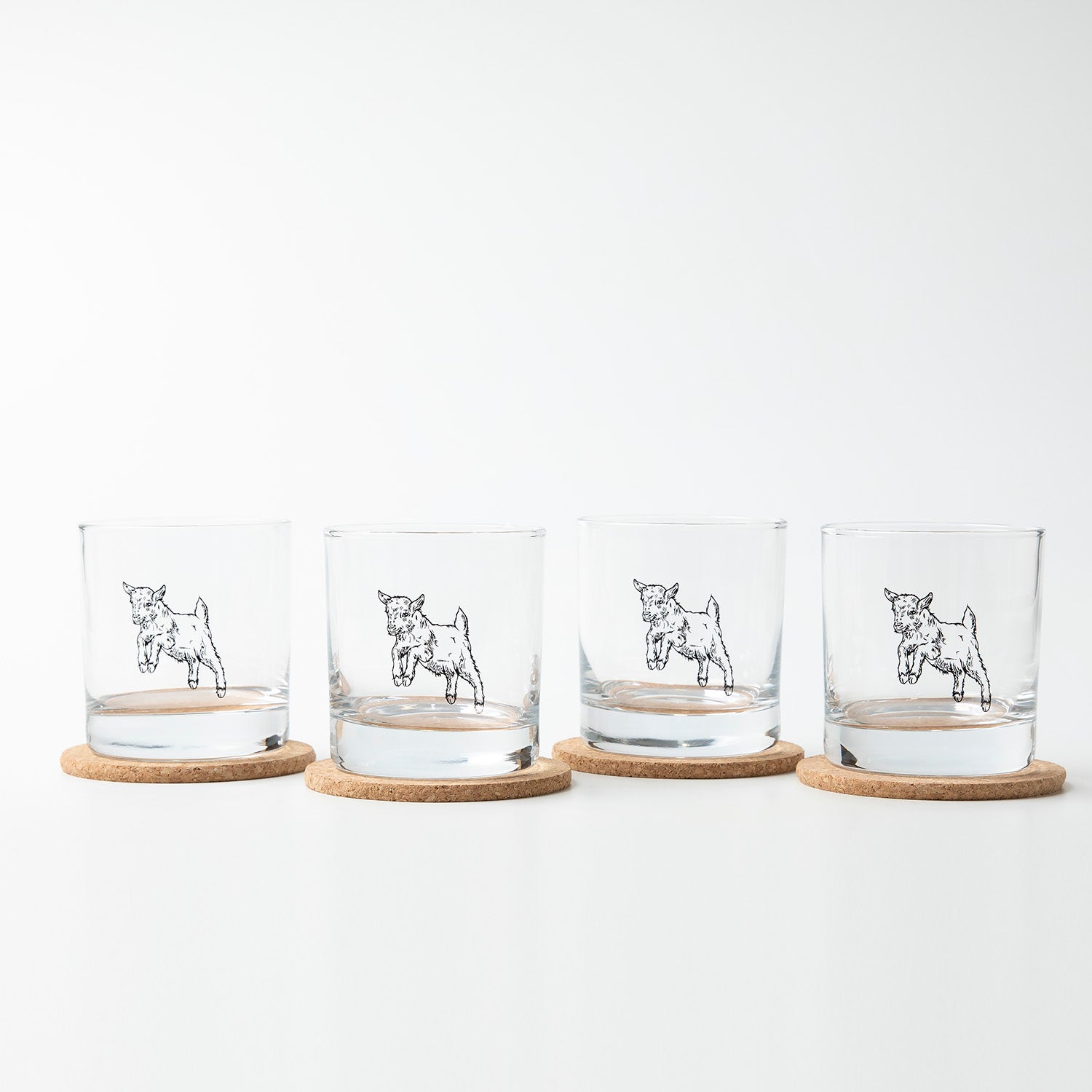 Elevate your drinkware collection with the Baby Goat Rocks Glass by Counter Couture, a lead-free glass designed for fun and functional use.