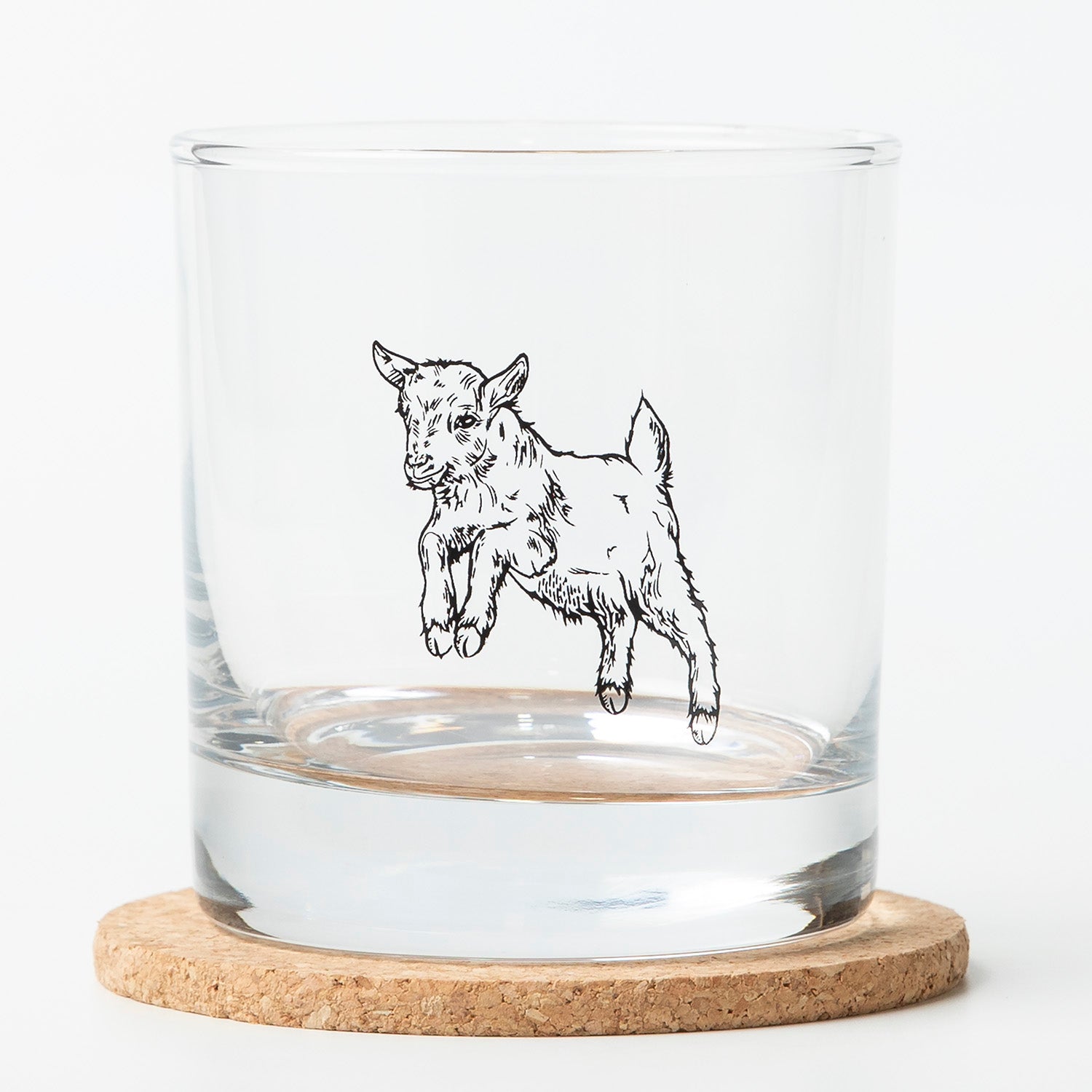 This stylish Baby Goat Rocks Glass from Counter Couture, designed for durability and charm, is ideal for serving classic drinks like bourbon and scotch.