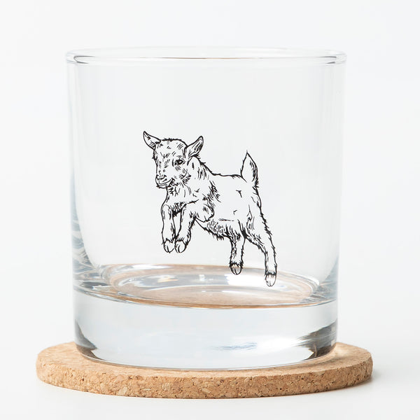 This stylish Baby Goat Rocks Glass from Counter Couture, designed for durability and charm, is ideal for serving classic drinks like bourbon and scotch.