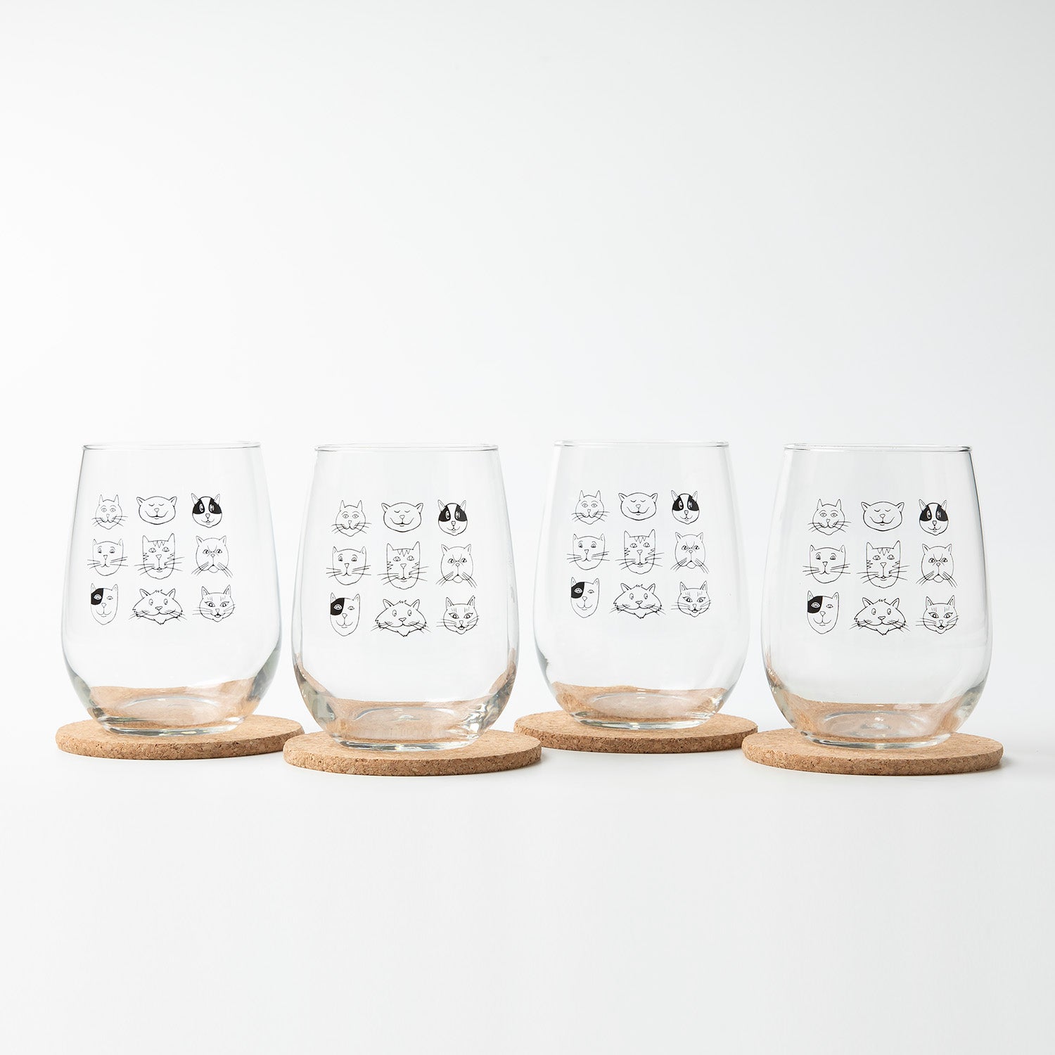 Elegant Cat Faces Stemless Wine Glass displaying whimsical silly cat faces, great for enjoying wine in style.