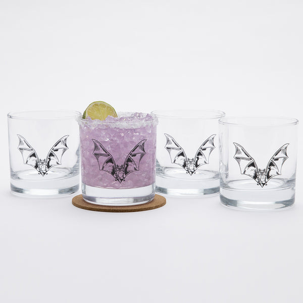 Set of 4 bat whiskey glasses on a white background.