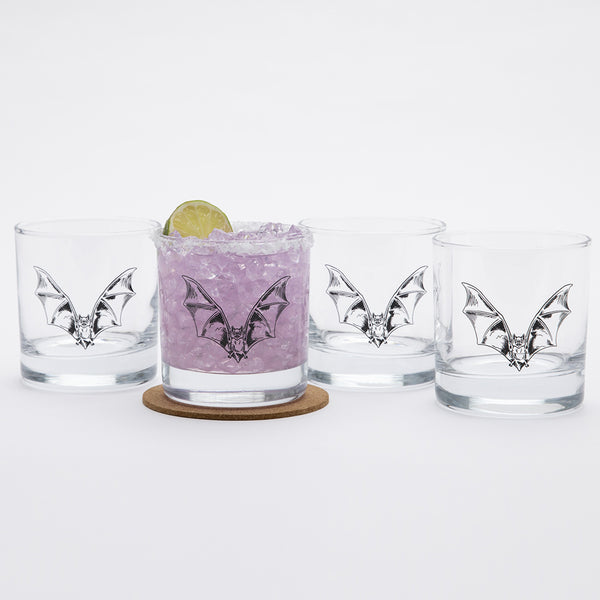 Set of 4 bat whiskey glasses on a white background.