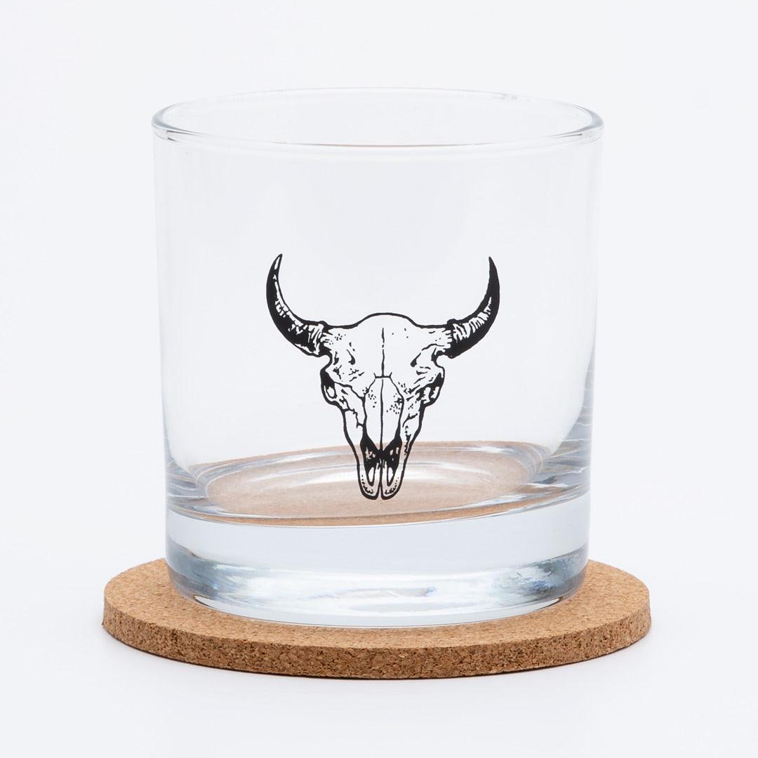 whiskey glass with screen printed buffalo skull on a white background.