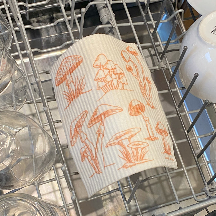 Close-up of the Mushroom Swedish Dish Cloth showcasing intricate mushroom patterns, ideal for sustainable home use.