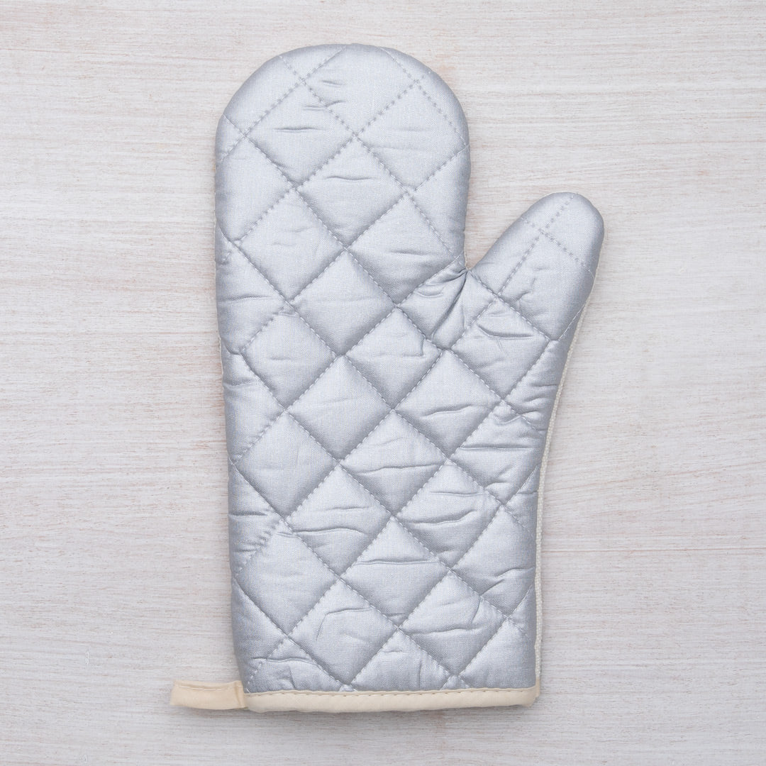 Close-up of the beautifully printed Sasquatch Oven Mitt made by Counter Couture, designed for heat resistance up to 500°.