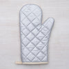 Close-up of the beautifully printed Sasquatch Oven Mitt made by Counter Couture, designed for heat resistance up to 500°.