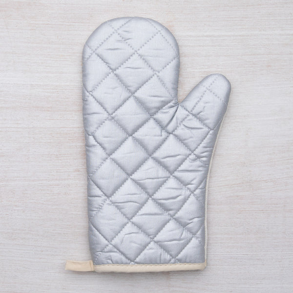 Close-up of the beautifully printed Sasquatch Oven Mitt made by Counter Couture, designed for heat resistance up to 500°.