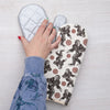 Sasquatch Oven Mitt hanging on a kitchen rack, showcasing its unique design and convenient fabric loop.
