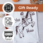 Flour sack tea towel with cowgirl on rearing horse illustration, text 'Yee Haw,' machine washable and gift ready.