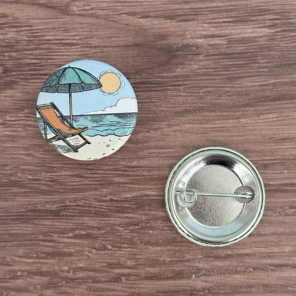 Cheerful Beach Life Button Pin by Counter Couture, perfect for adding a unique touch to your accessories. Ideal beach life pin for backpacks, jackets, and shirts.