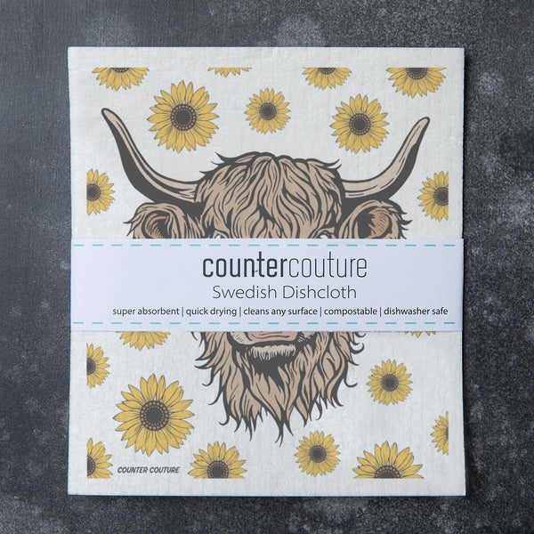 Bright and cheerful Highland Cow Swedish Dishcloth by Counter Couture, designed to make cleaning enjoyable and sustainable.