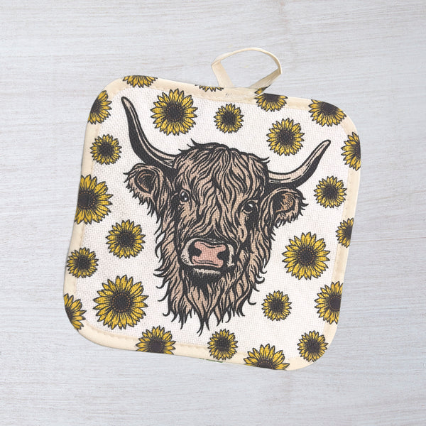 Cheerful Highland Cow Potholder showcased in a vibrant kitchen setting, perfect for grabbing hot dishes and adding a rustic touch to your home.