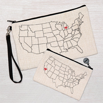 Two canvas zipper pouches with USA map outline and red heart designs, wrist strap attached.