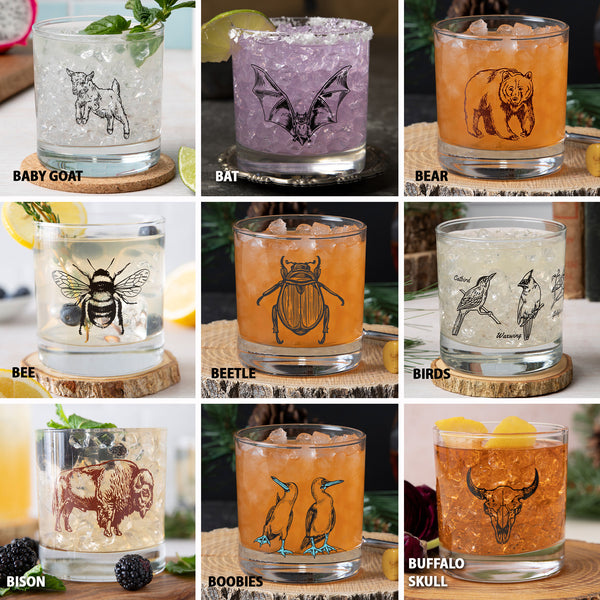 Assorted animal and insect rocks glasses with ice and cocktails, each featuring unique etched designs.