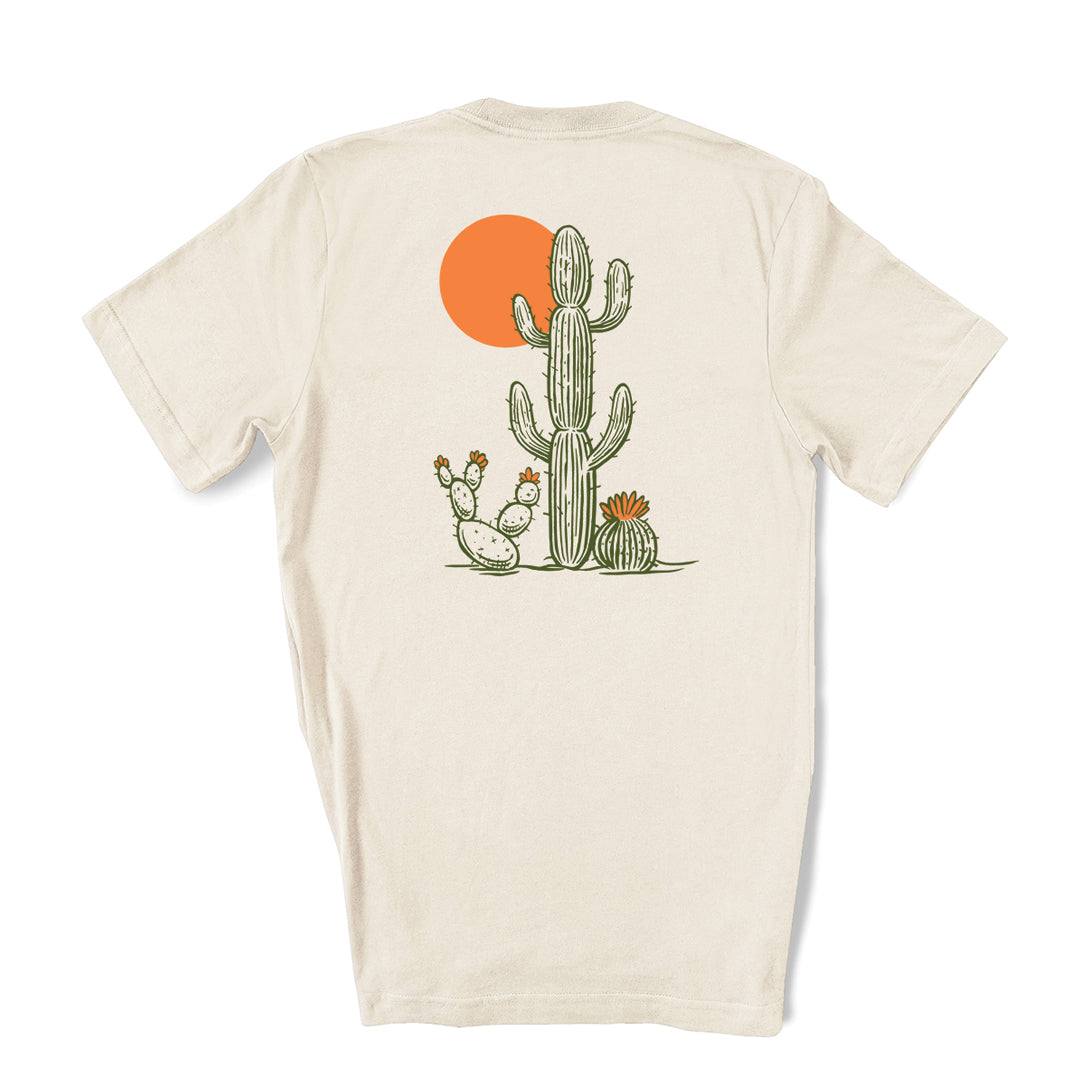 Saguaro Unisex Graphic T-shirt displayed with vibrant green and orange screen print on oatmeal background, perfect for casual or active wear.