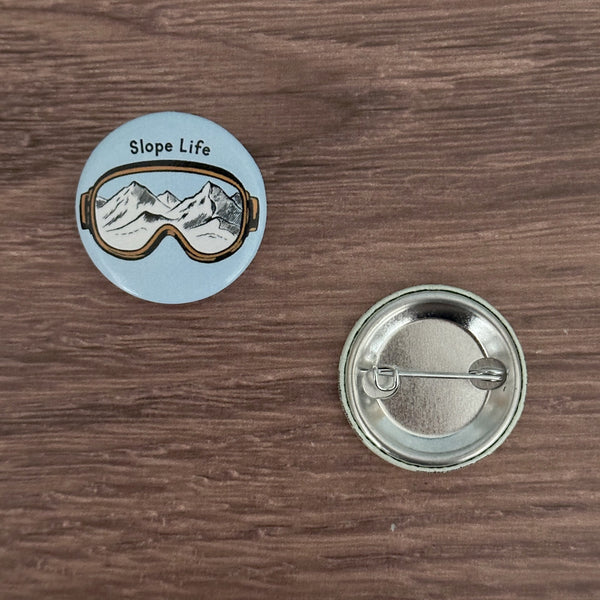 Slope Life Button Pin from Counter Couture, a stylish addition for bags and jackets, perfect as button pins for bags.