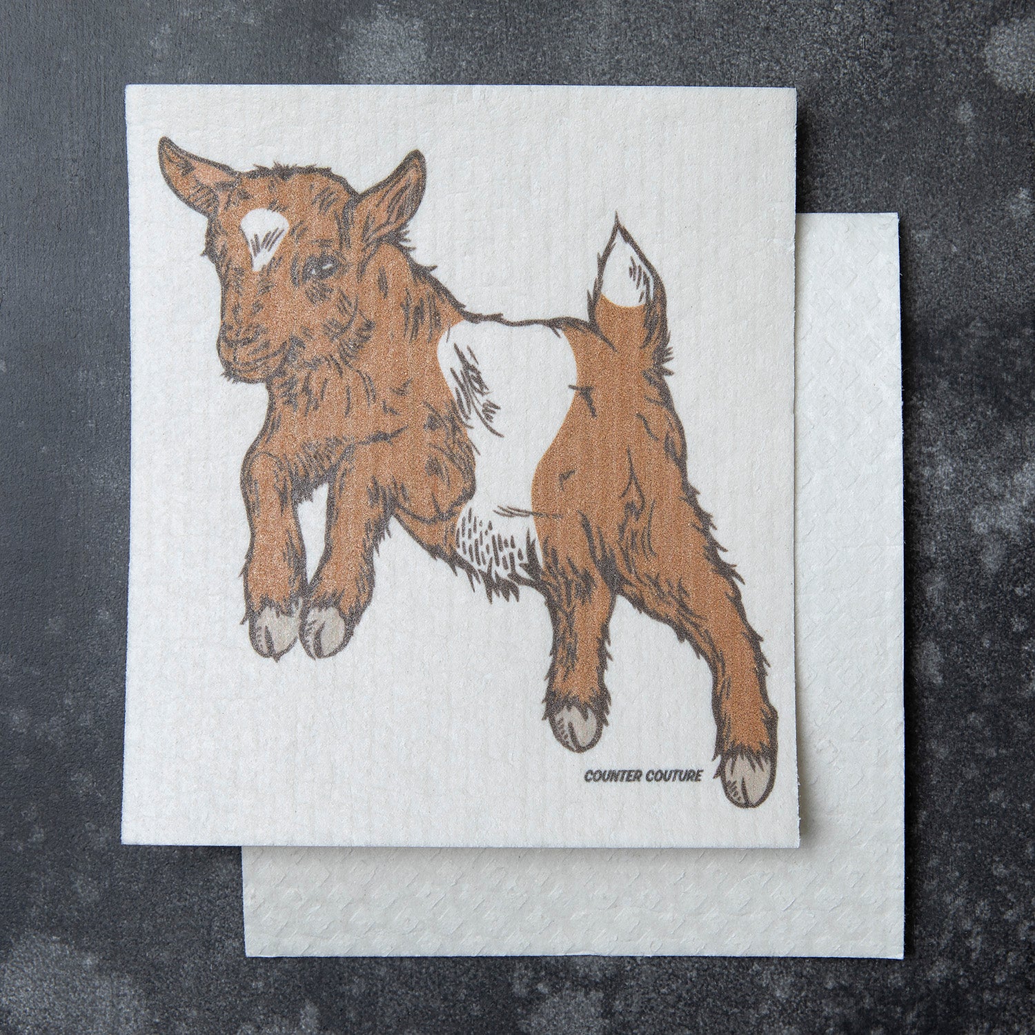 Baby Goat Swedish Dish Cloth by Counter Couture, showcasing its adorable goat design on a versatile cleaning cloth.