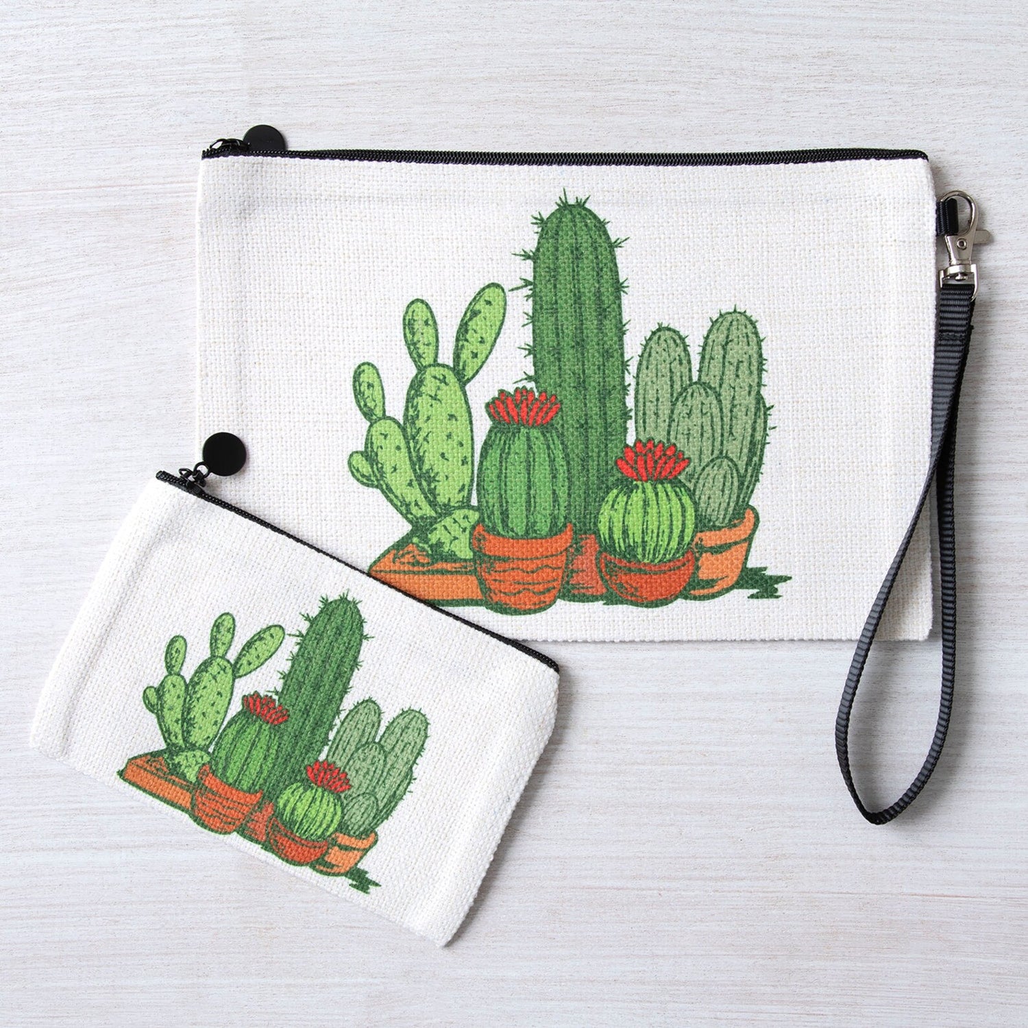 Cactus print zipper pouches set with wrist strap on white background