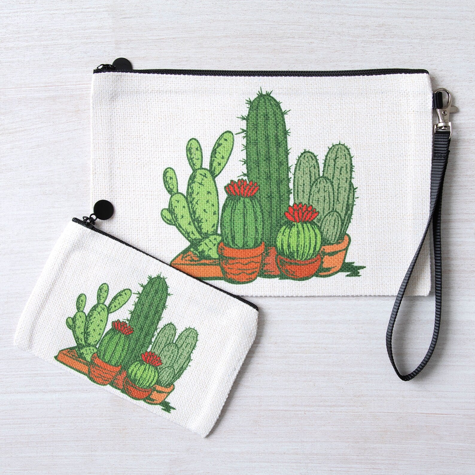 Cactus print zipper pouches set with wrist strap on white background