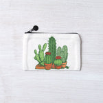 White zipper pouch with hand-drawn cactus and succulent illustration on a light background