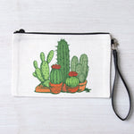 Canvas zipper pouch with colorful potted cactus illustration and detachable black wrist strap