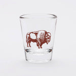 Clear shot glass featuring a brown bison graphic on a white background