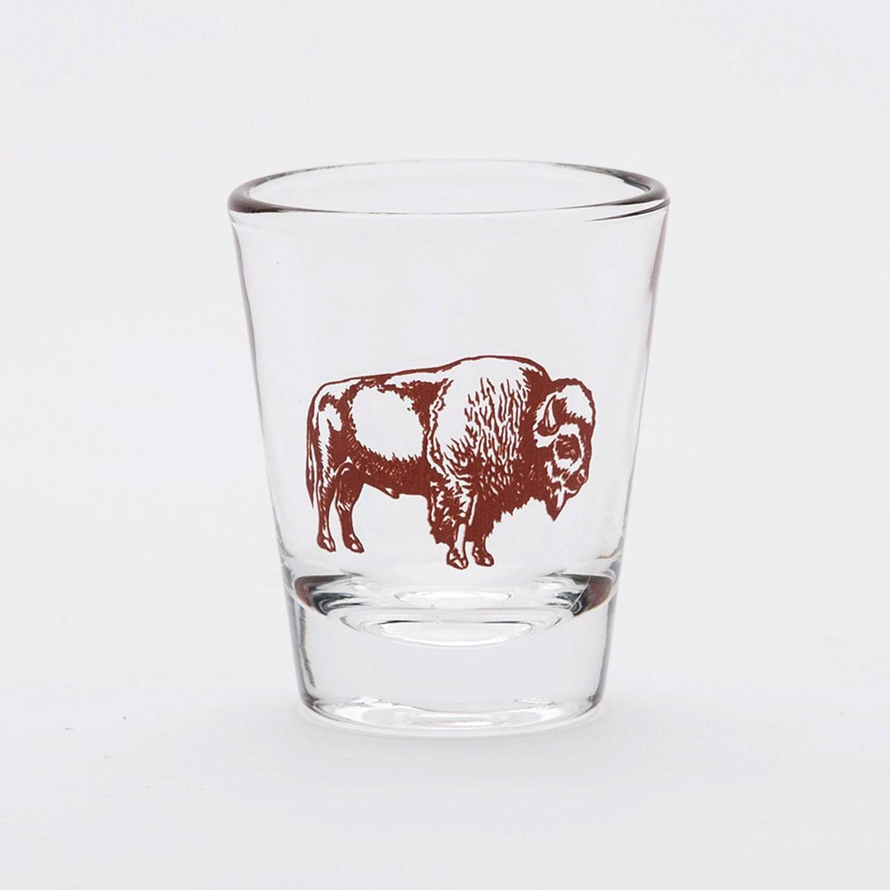 Clear shot glass featuring a brown bison graphic on a white background