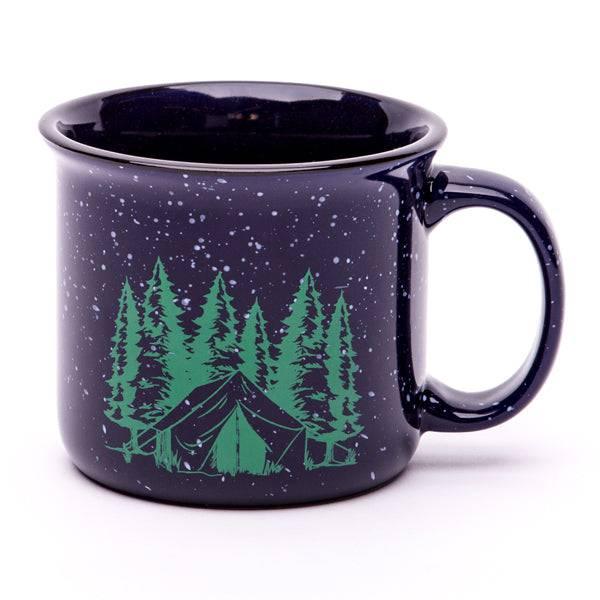 Navy blue camping mug with green tent and pine trees graphic, speckled enamel finish
