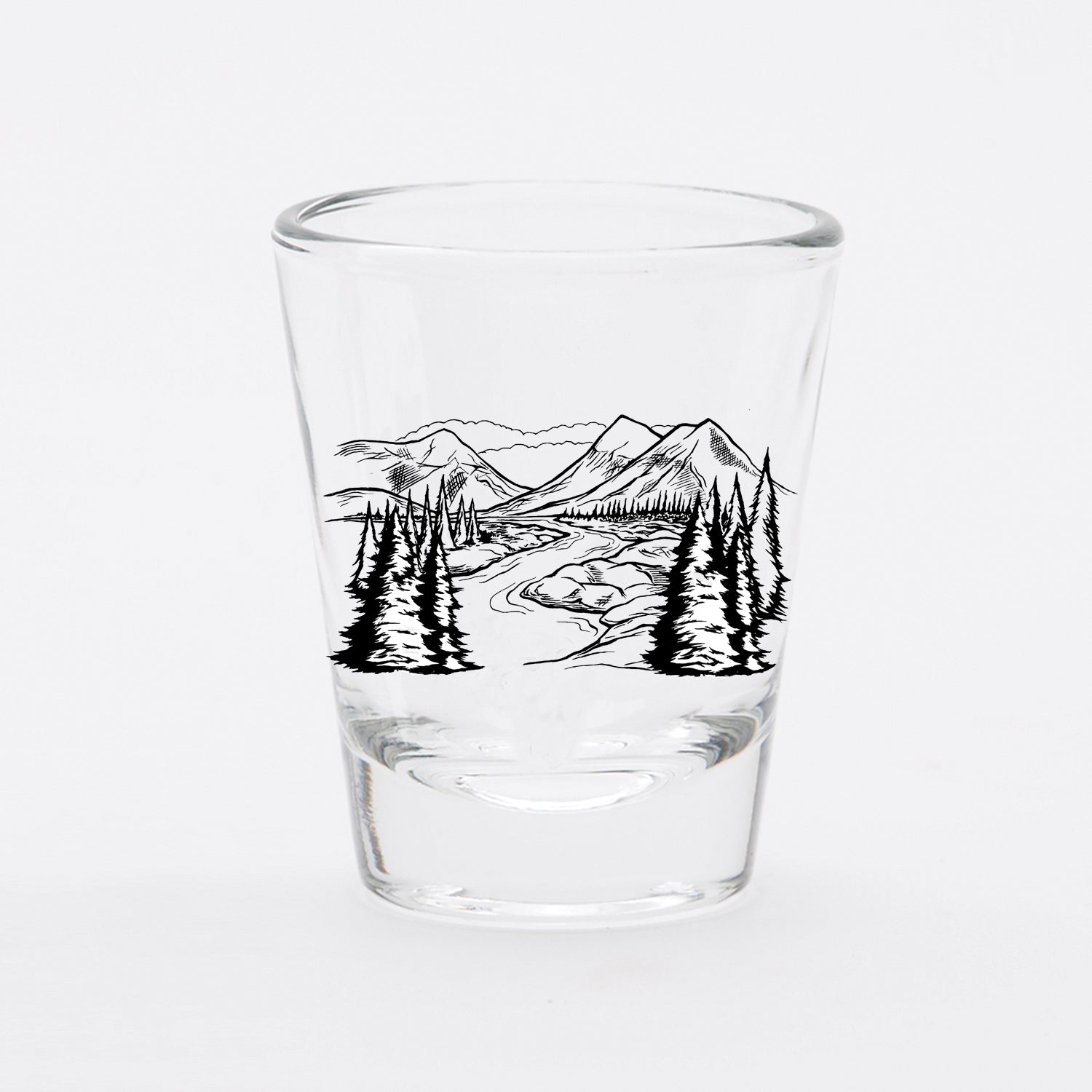 Clear shot glass with black mountain and pine tree illustration, unique barware
