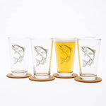 Set of four pint glasses with trout fish design on cork coasters, one filled with beer